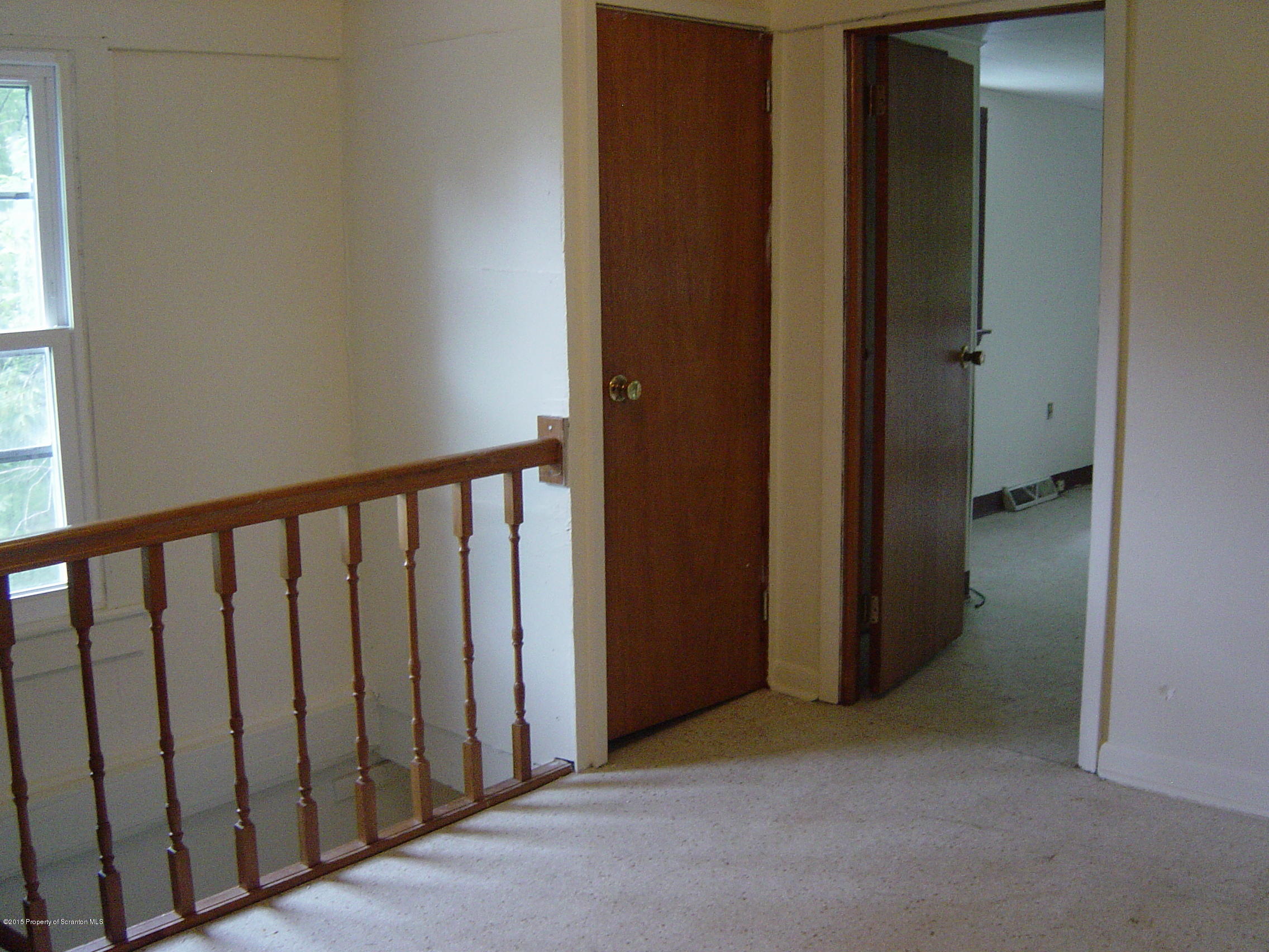 2471 Motichka Road Moscow, PA 18444 - Photo 13 of 20 a view of a hallway with wooden floor