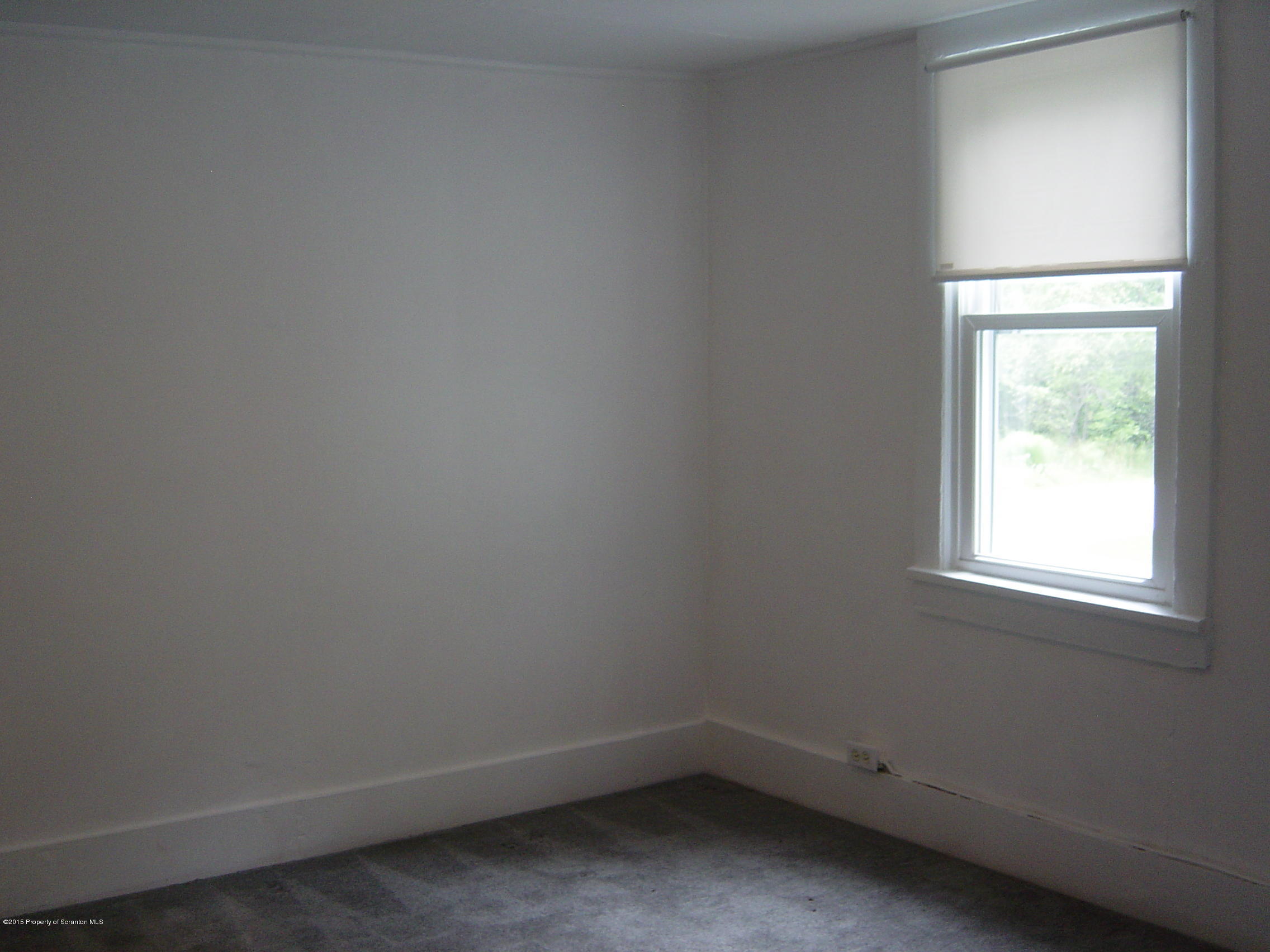 2471 Motichka Road Moscow, PA 18444 - Photo 5 of 20 an empty room with a window