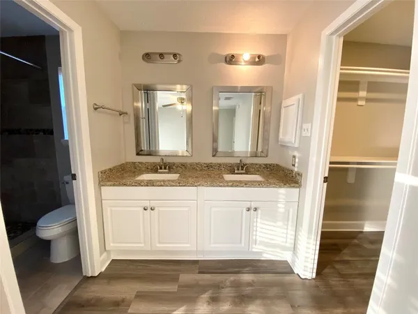 a bathroom with a glass shower door