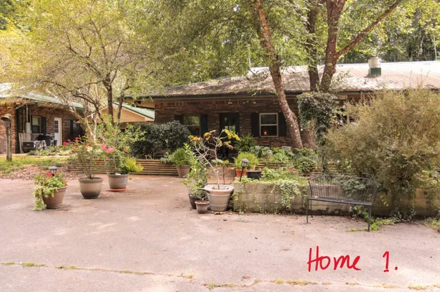 a view of house with patio outdoor seating