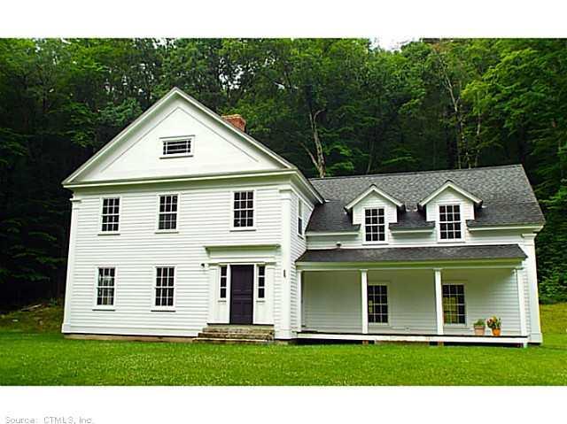 449 River Road Sharon, CT 06069 - Photo 1 of 1 a front view of a house with a yard