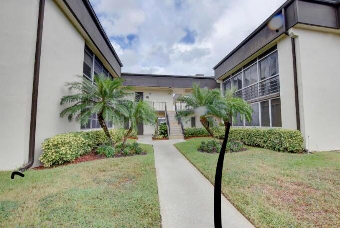 55 Capri B Delray Beach, FL 33484 - Photo 1 of 6 a view of a yard in front of a house