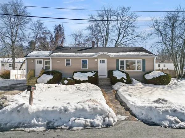 a view of a house with snow on a patio
