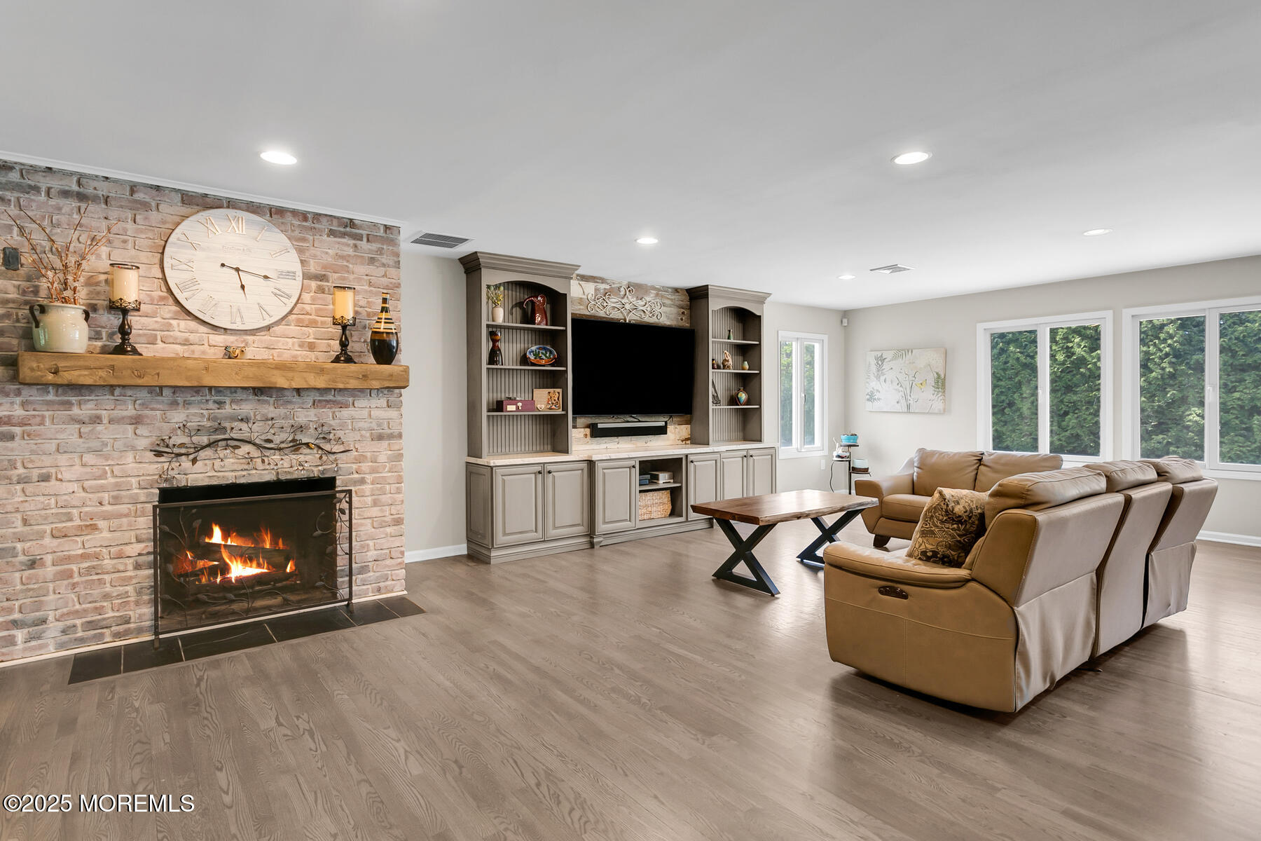 28 Colonial Terrace Colts Neck, NJ 07722 - Photo 10 of 57 a living room with furniture fireplace and flat screen tv