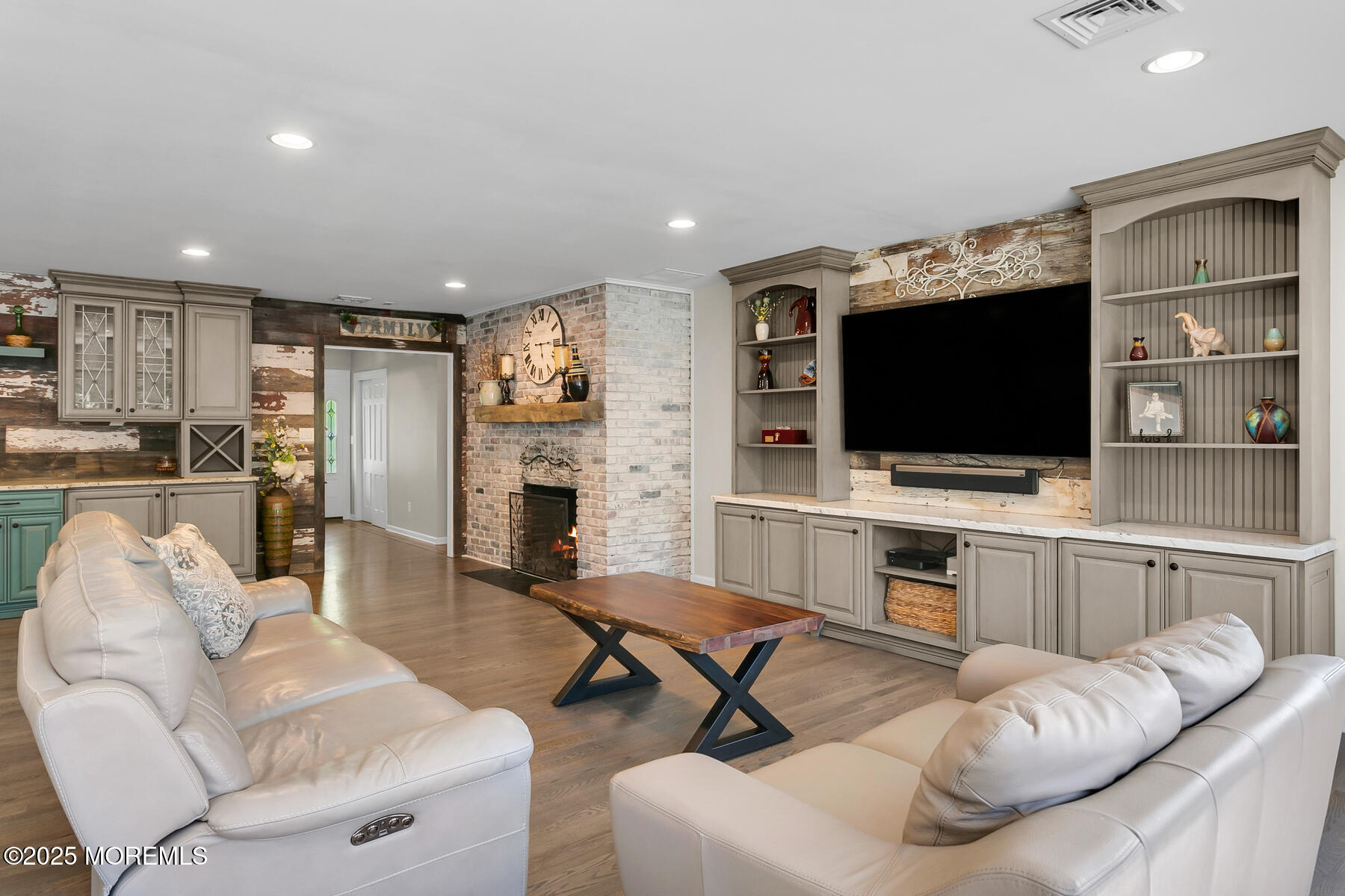 28 Colonial Terrace Colts Neck, NJ 07722 - Photo 13 of 57 a living room with furniture and a flat screen tv