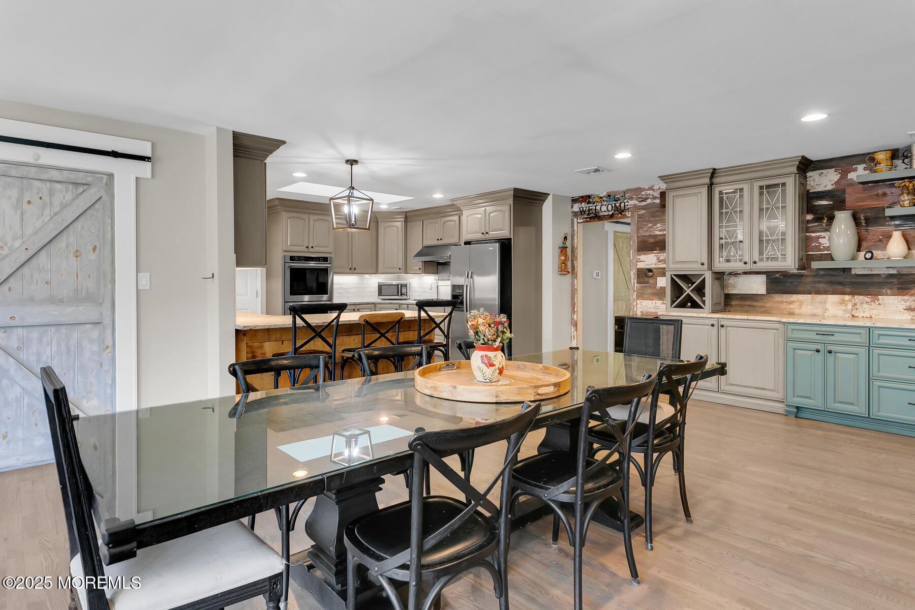 28 Colonial Terrace Colts Neck, NJ 07722 - Photo 15 of 57 a view of a dining room with furniture and wooden floor