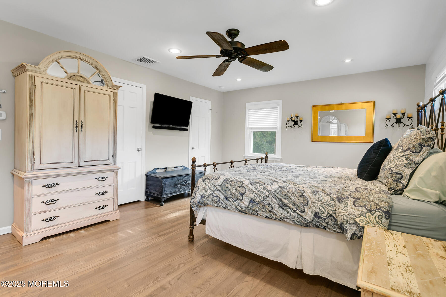 28 Colonial Terrace Colts Neck, NJ 07722 - Photo 20 of 57 a bedroom with a bed and a flat screen tv