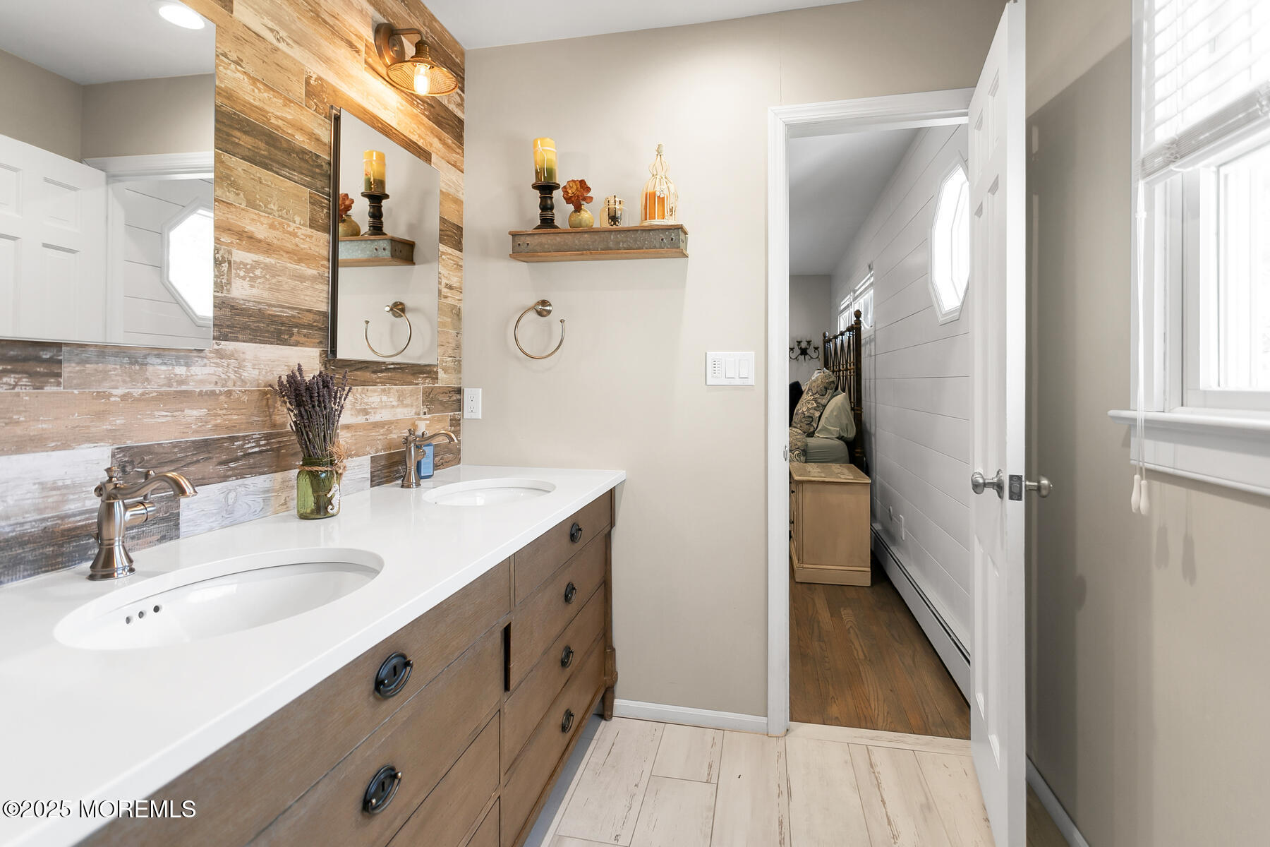 28 Colonial Terrace Colts Neck, NJ 07722 - Photo 23 of 57 a bathroom with double vanity sink and a mirror