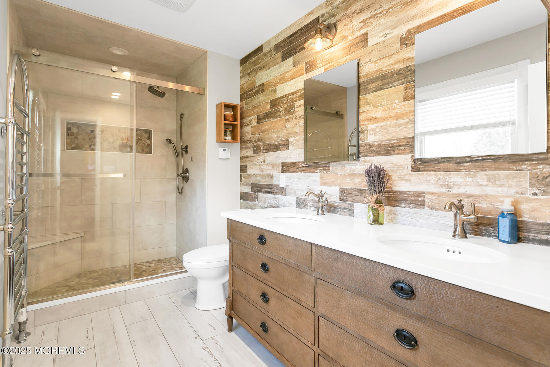 28 Colonial Terrace Colts Neck, NJ 07722 - Photo 24 of 57 a bathroom with a double vanity sink toilet and shower