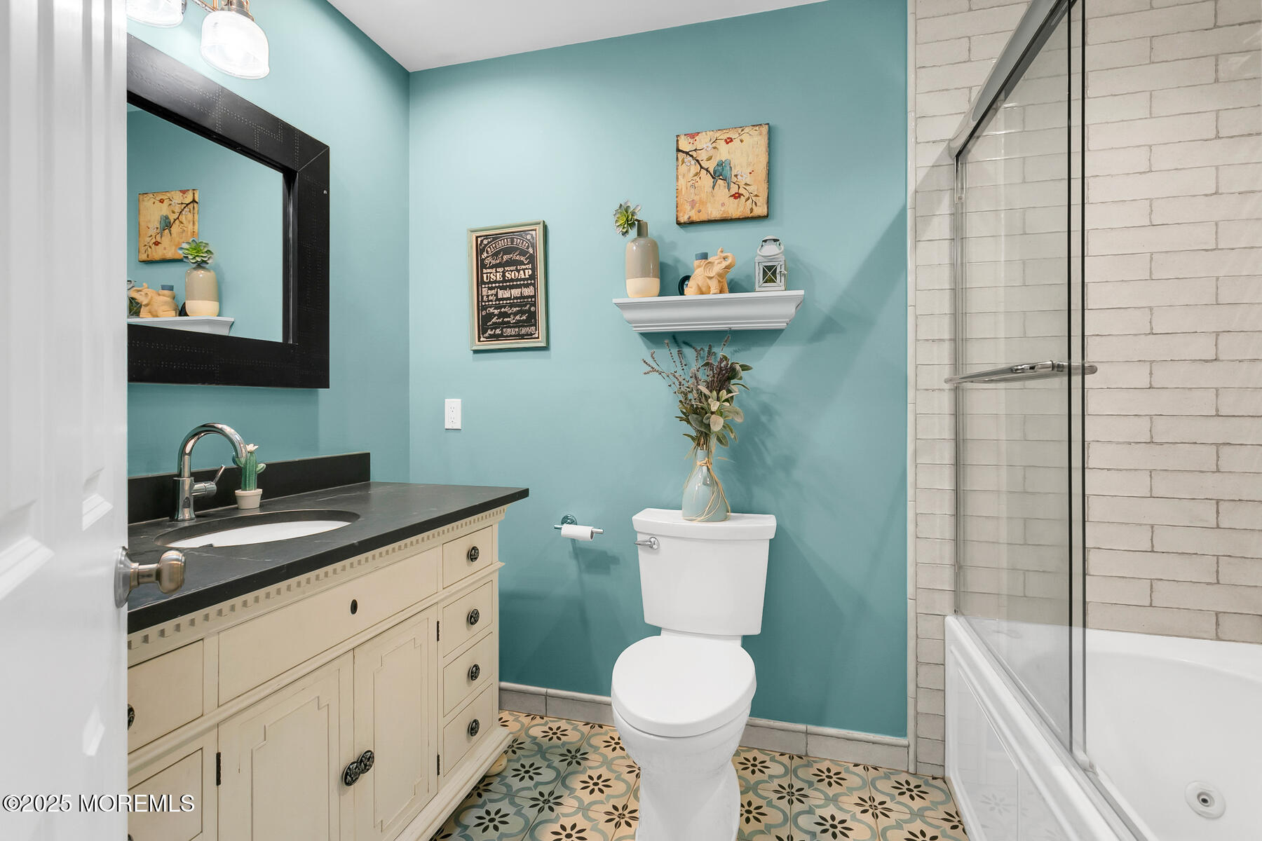 28 Colonial Terrace Colts Neck, NJ 07722 - Photo 27 of 57 a bathroom with a toilet sink and mirror