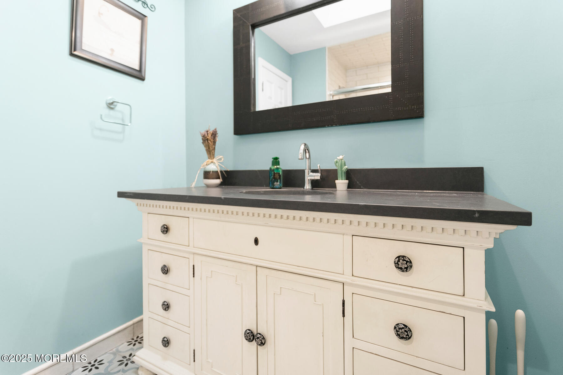 28 Colonial Terrace Colts Neck, NJ 07722 - Photo 28 of 57 a bathroom with a sink vanity and mirror