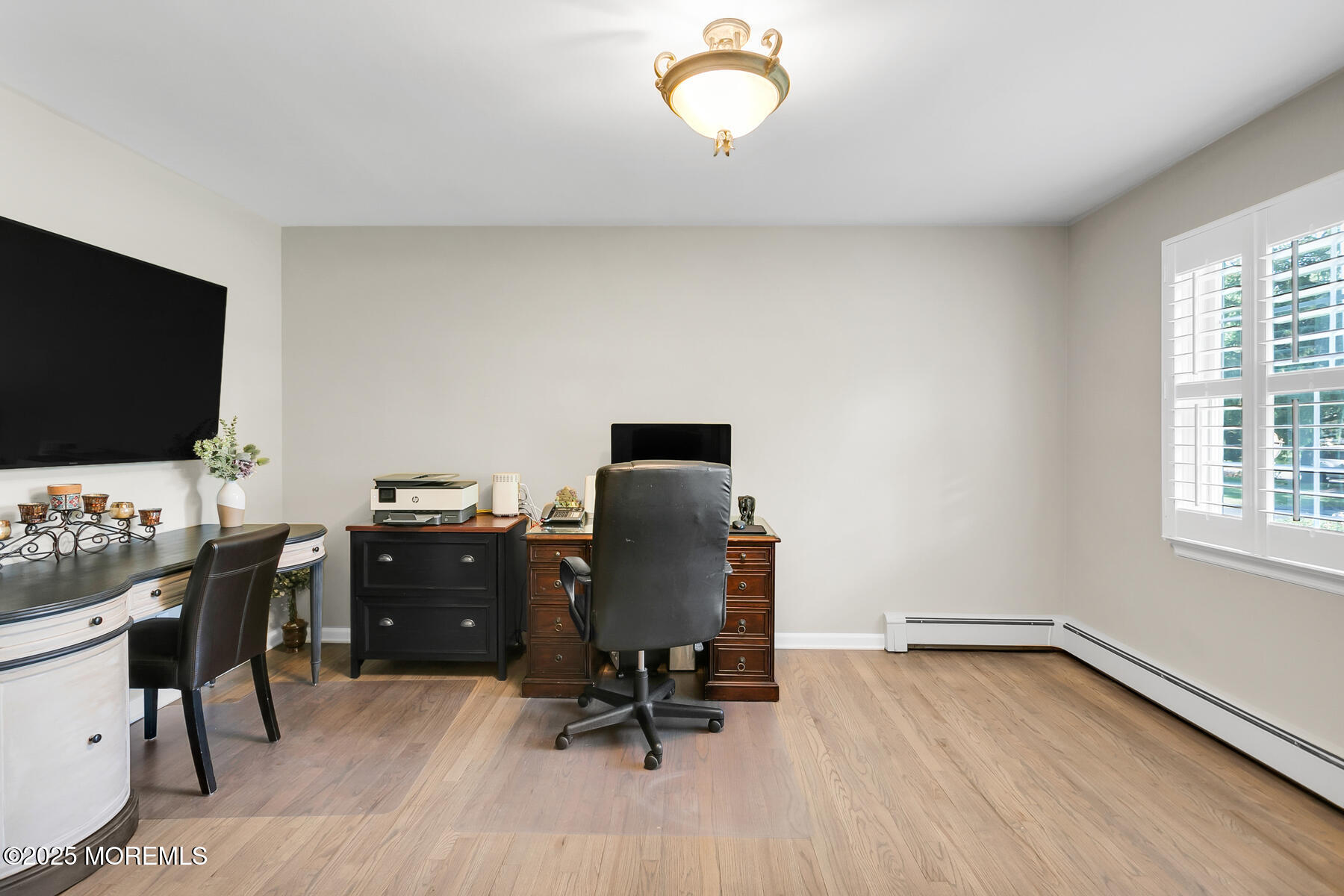 28 Colonial Terrace Colts Neck, NJ 07722 - Photo 32 of 57 a view of a workspace with furniture and a window
