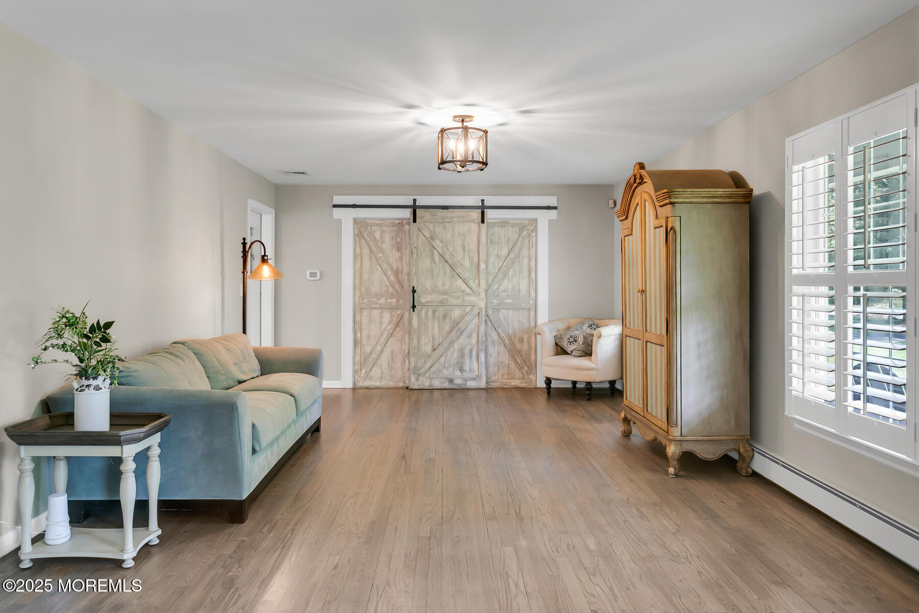 28 Colonial Terrace Colts Neck, NJ 07722 - Photo 33 of 57 a living room with furniture and a chandelier