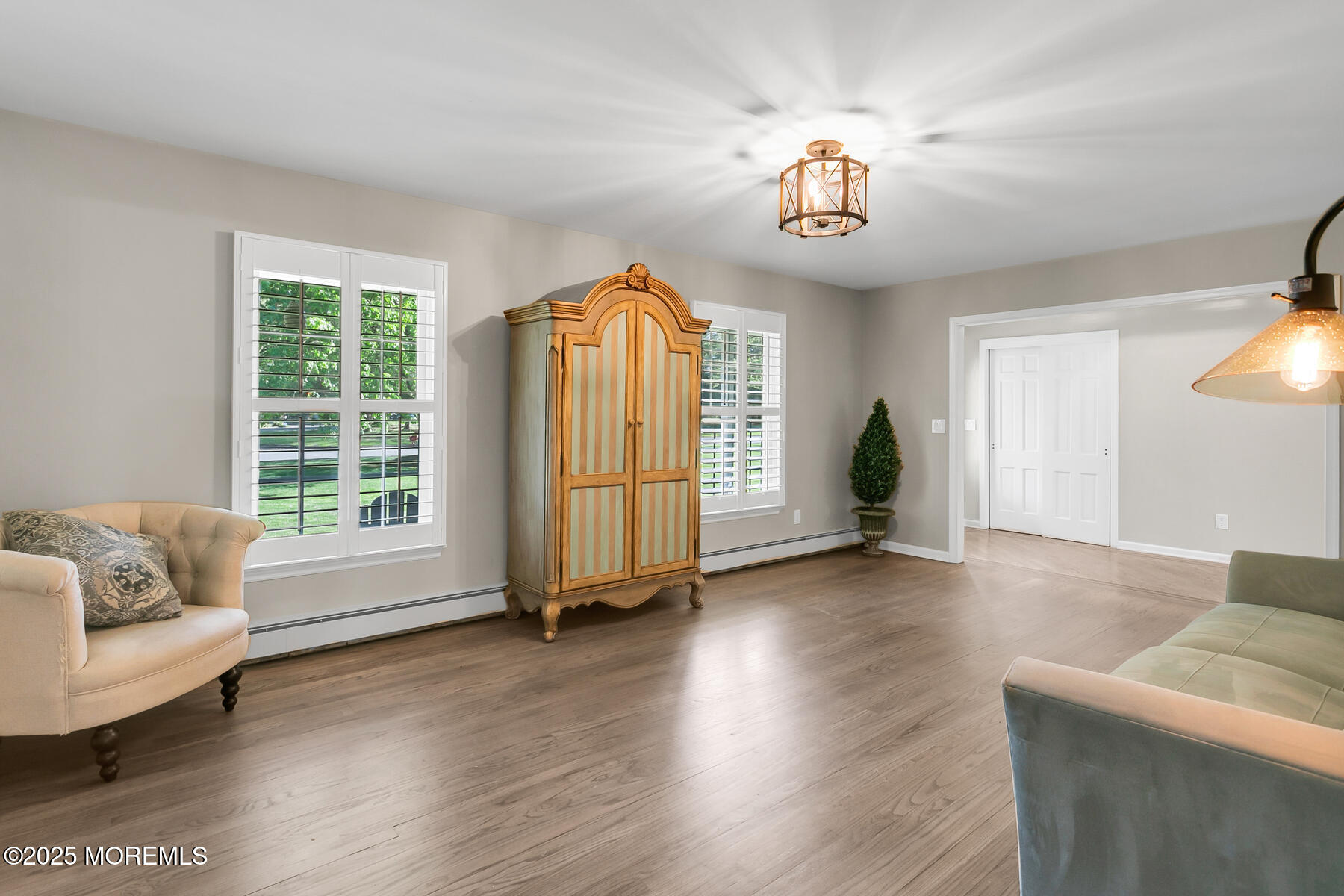 28 Colonial Terrace Colts Neck, NJ 07722 - Photo 34 of 57 a view of livingroom with furniture wooden floor and windows
