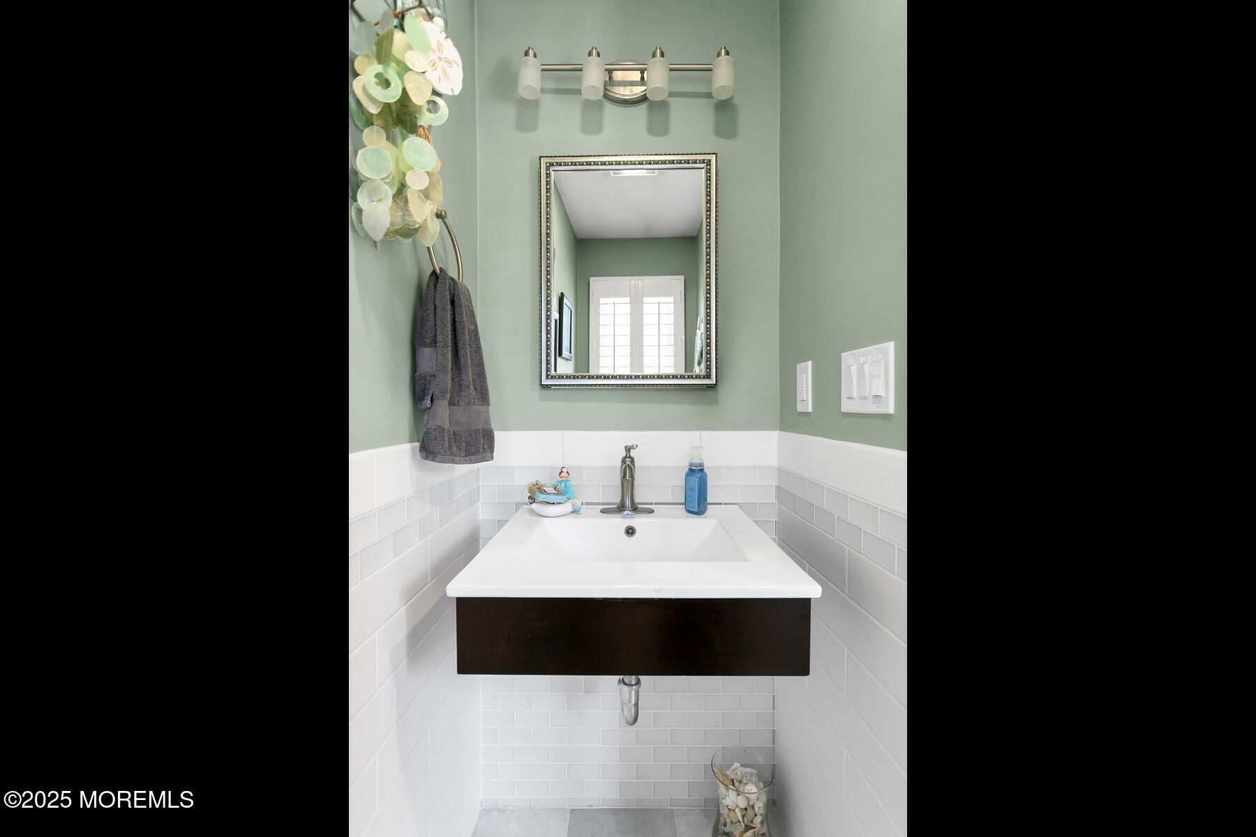 28 Colonial Terrace Colts Neck, NJ 07722 - Photo 38 of 57 a bathroom with a sink and a mirror