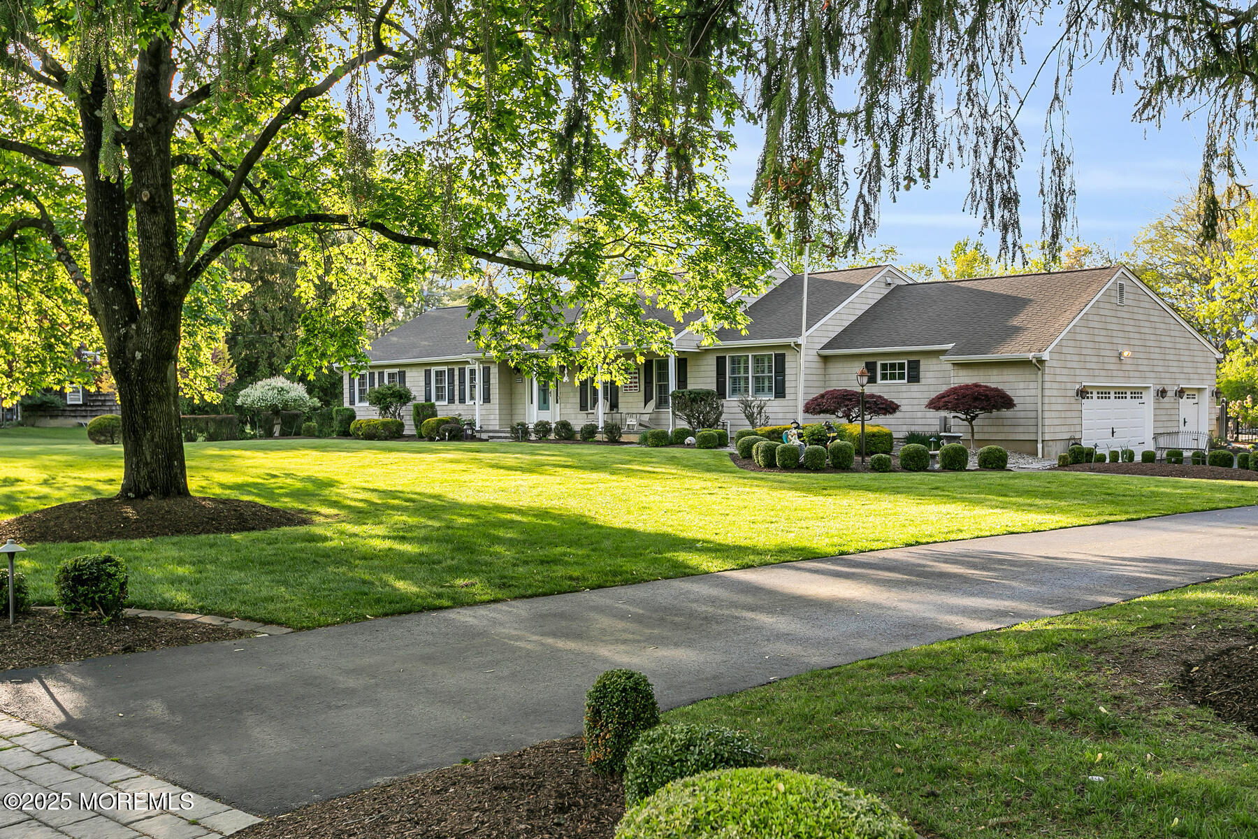 28 Colonial Terrace Colts Neck, NJ 07722 - Photo 42 of 57 a view of house with swimming pool and tall trees