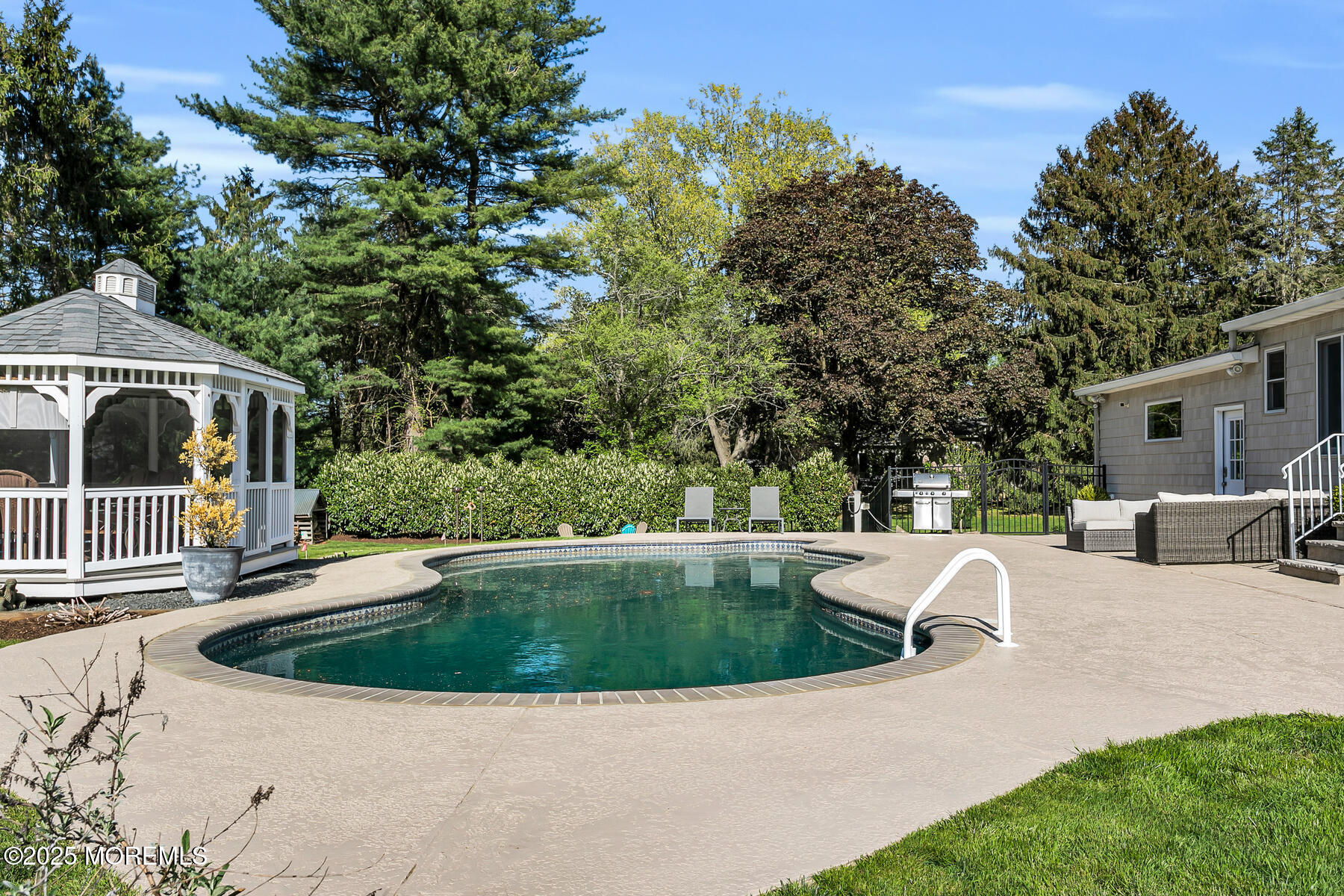 28 Colonial Terrace Colts Neck, NJ 07722 - Photo 45 of 57 a view of a swimming pool with patio
