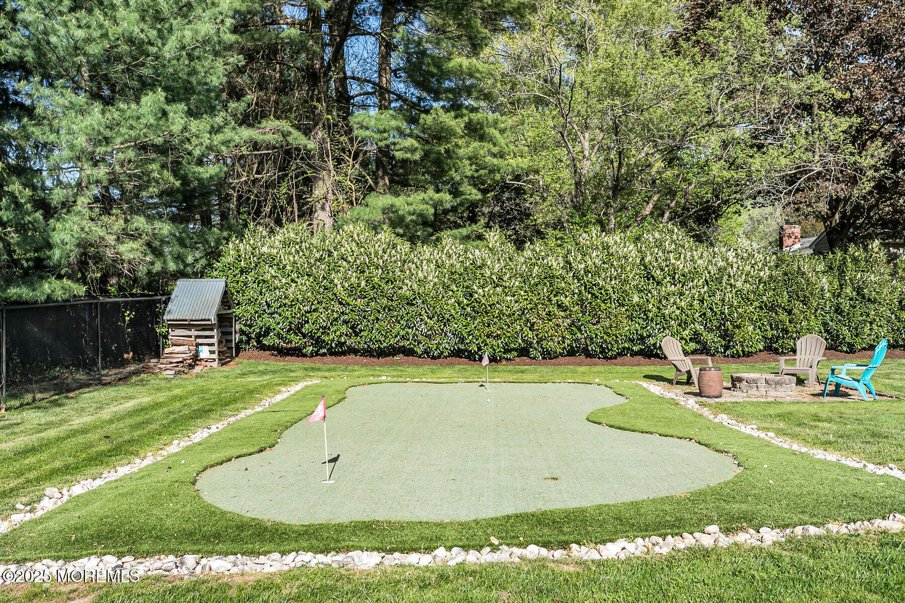 28 Colonial Terrace Colts Neck, NJ 07722 - Photo 49 of 57 a view of a swimming pool with a yard