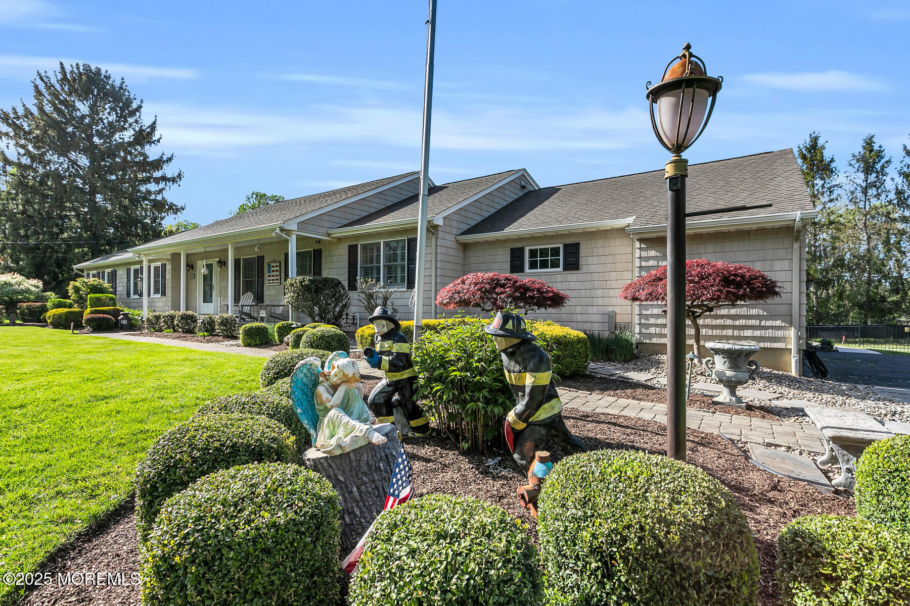28 Colonial Terrace Colts Neck, NJ 07722 - Photo 50 of 57 a front view of a house with garden