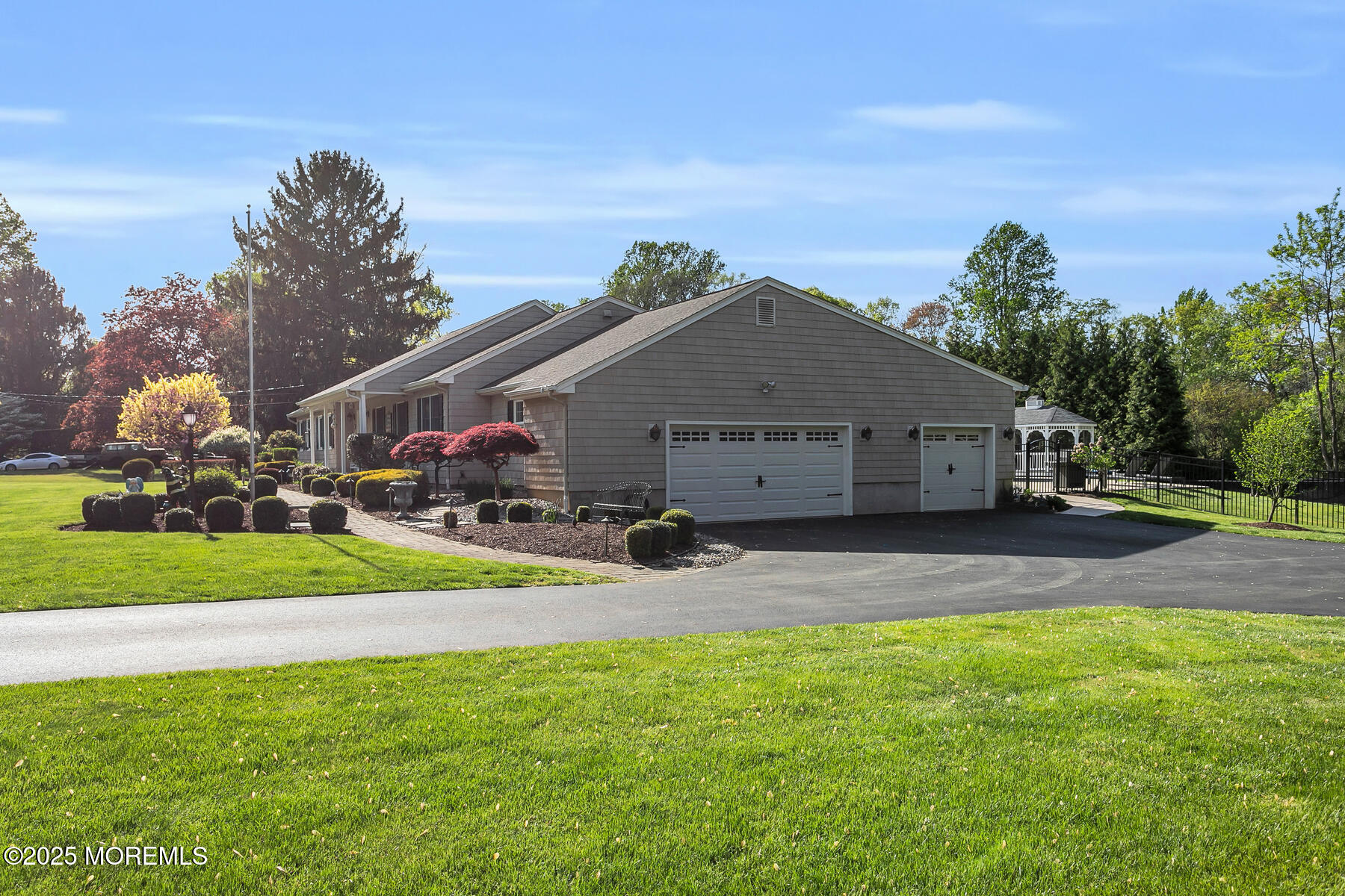 28 Colonial Terrace Colts Neck, NJ 07722 - Photo 52 of 57 a front view of house with yard garage and green space