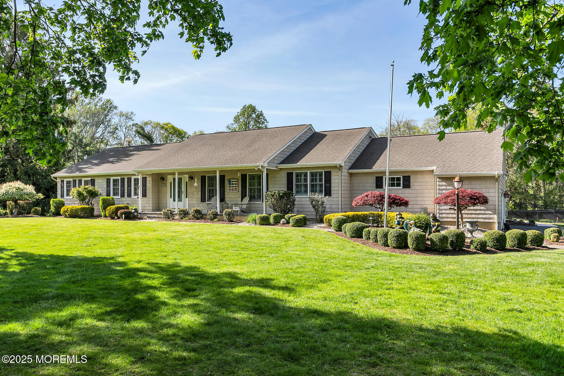 28 Colonial Terrace Colts Neck, NJ 07722 - Photo 53 of 57 a front view of house with yard and green space