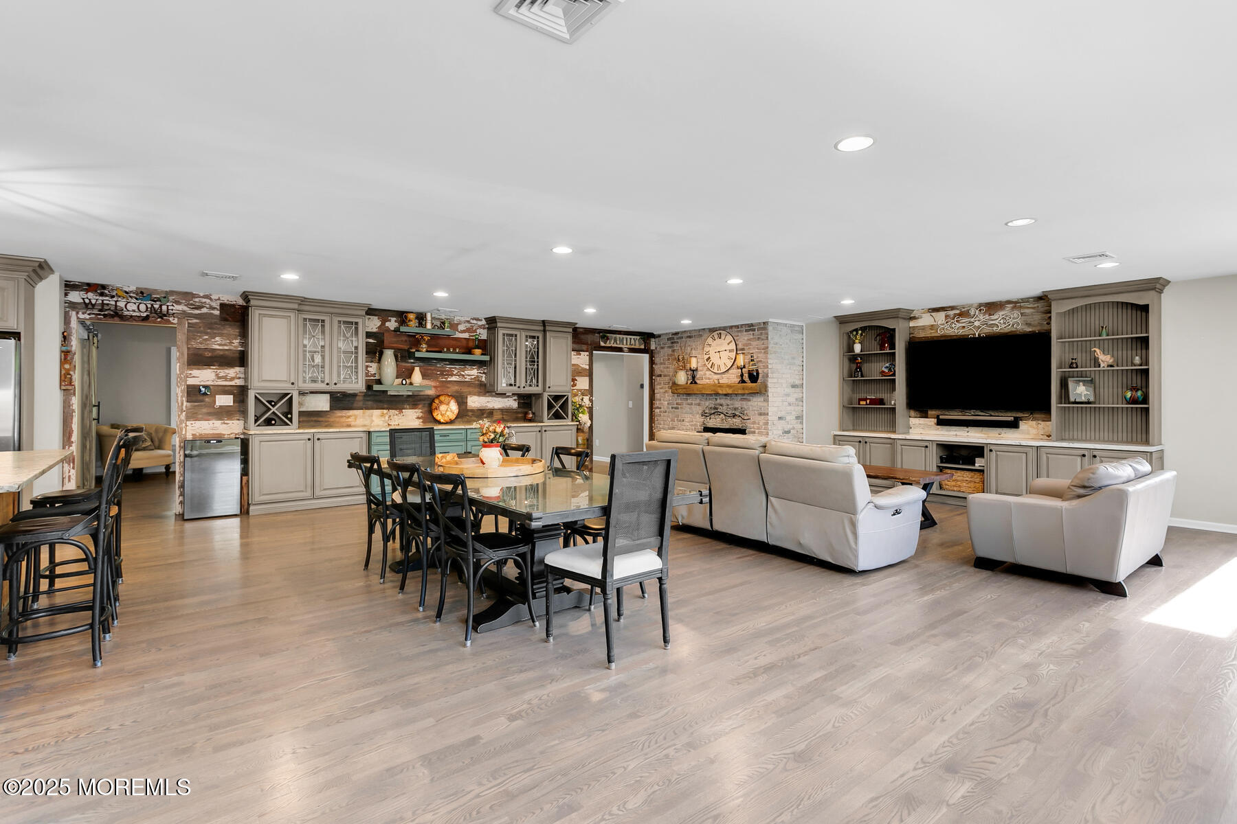 28 Colonial Terrace Colts Neck, NJ 07722 - Photo 9 of 57 a living room with furniture and a flat screen tv