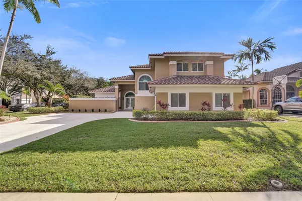 a front view of a house with a yard