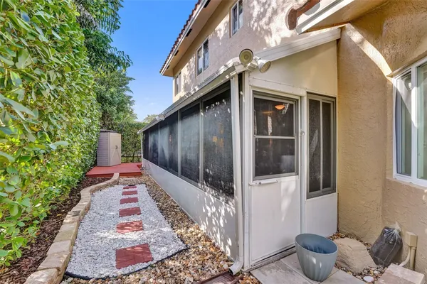 a kitchen with granite countertop stainless steel appliances a refrigerator a stove a sink and cabinets