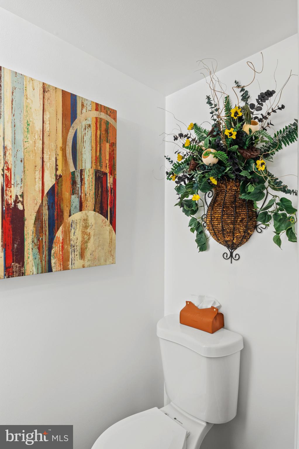 9550 Transfer Row Columbia, MD 21045 - Photo 12 of 27 a bathroom with a toilet sink and mirror