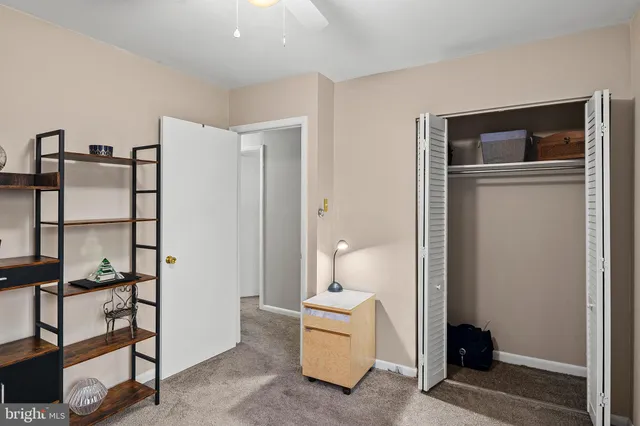 a bathroom with a sink a toilet and shower curtain