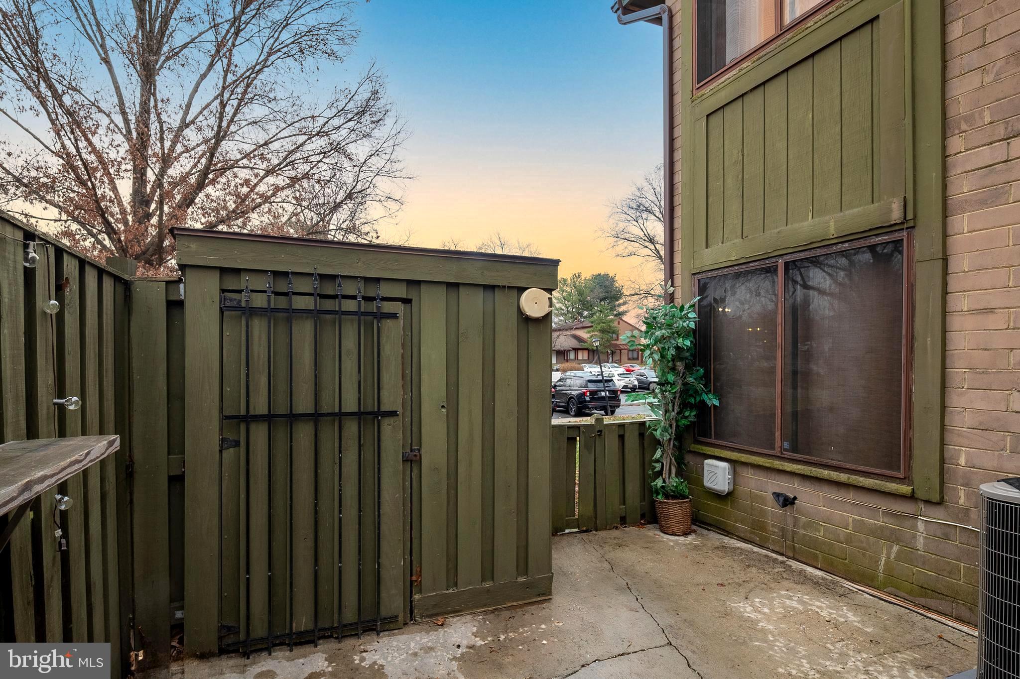 9550 Transfer Row Columbia, MD 21045 - Photo 23 of 27 a view of a house with backyard and wooden fence