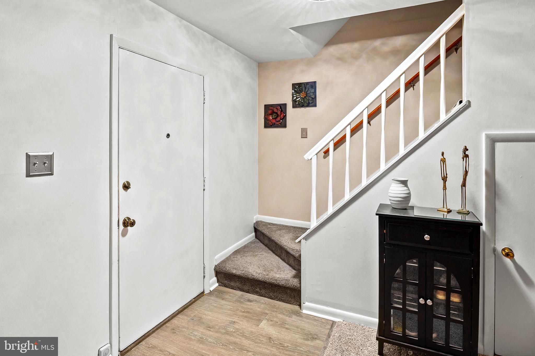 9550 Transfer Row Columbia, MD 21045 - Photo 4 of 27 a view of entryway with wooden floor and stairs