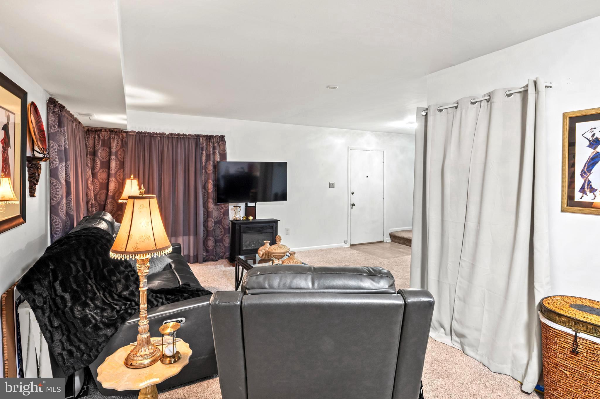 9550 Transfer Row Columbia, MD 21045 - Photo 6 of 27 a room with furniture a window and a flat screen tv