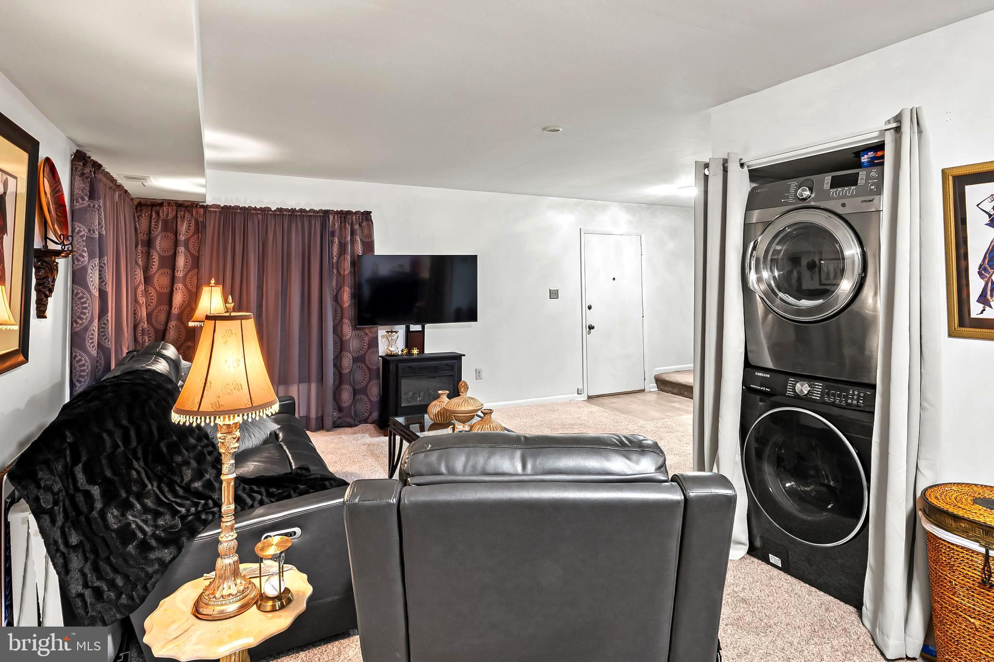 9550 Transfer Row Columbia, MD 21045 - Photo 7 of 27 a view of a living room with washer and dryer