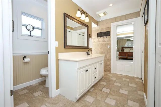 a kitchen with stainless steel appliances granite countertop a refrigerator stove and microwave