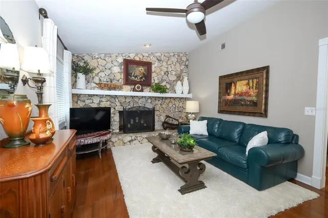 a living room with furniture potted plant and a window