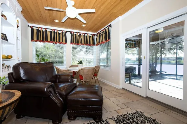 a bed room with a bed and a chair