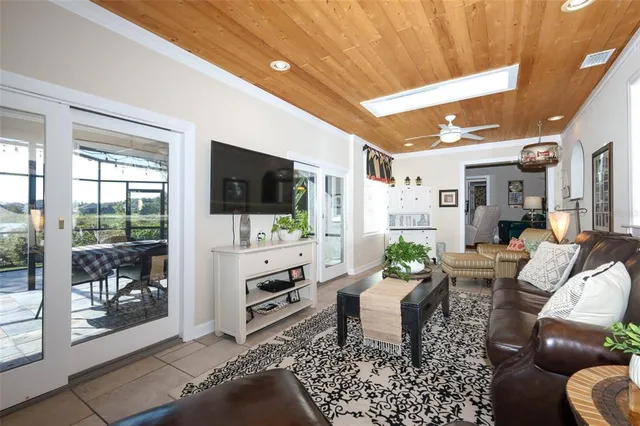a patio with yard glass top table and chairs