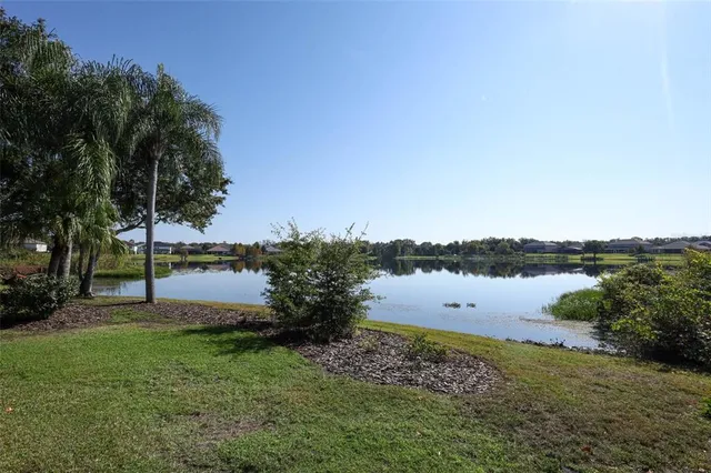 an aerial view of city and lake view