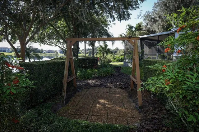a street sign that is on a brick wall