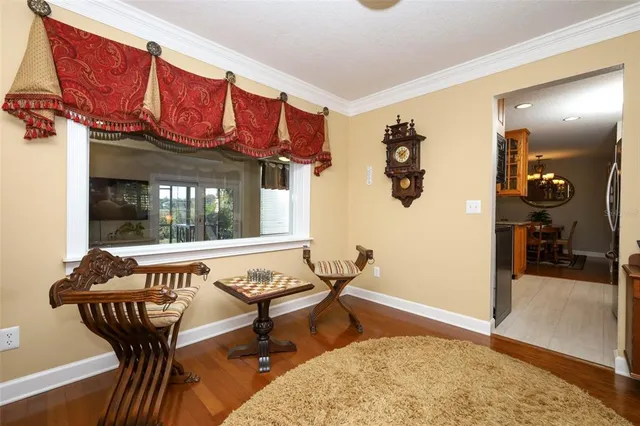 a bedroom with a bed and a mirror on dresser