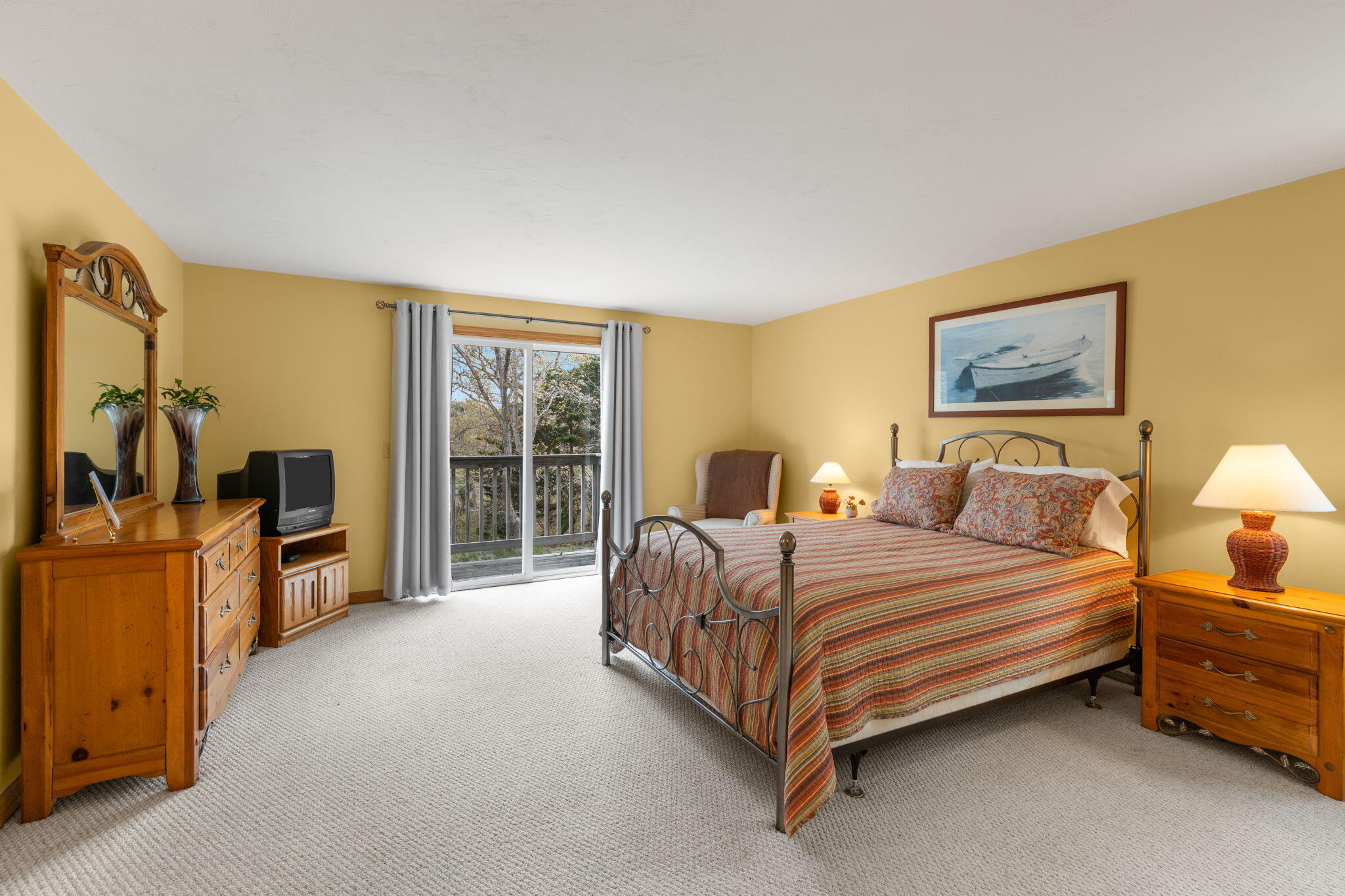 285 Blue Heron Road Wellfleet, MA 02667 - Photo 16 of 31 a spacious bedroom with a bed and dresser