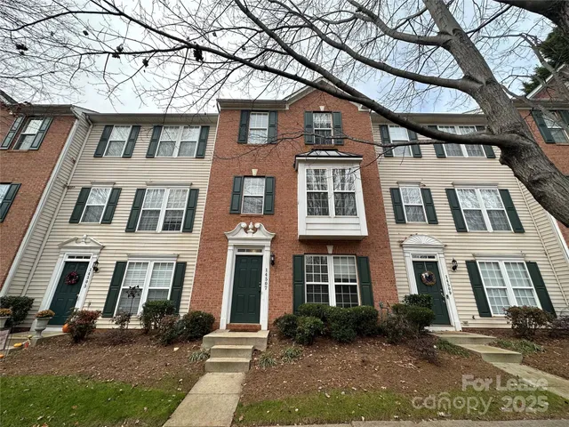 a front view of a building with garden