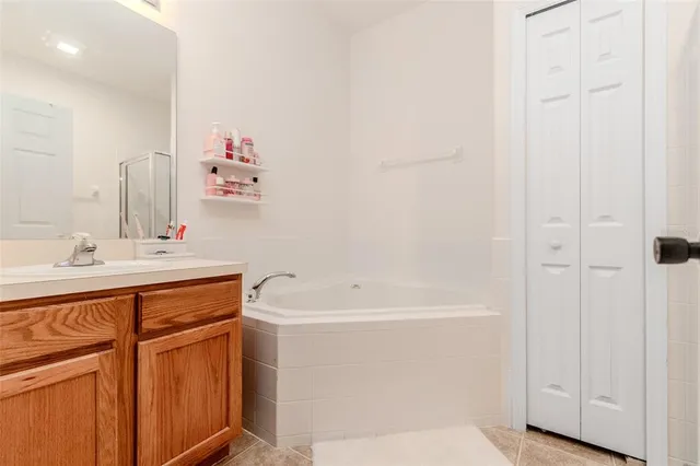 a bathroom with a sink a mirror and a bathtub