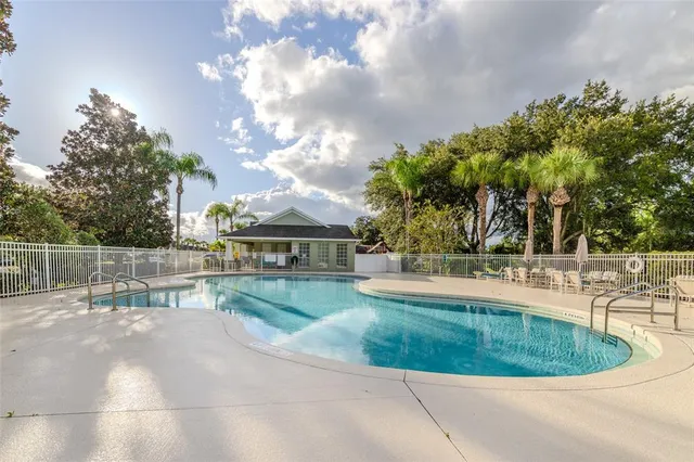 a view of a swimming pool with a patio