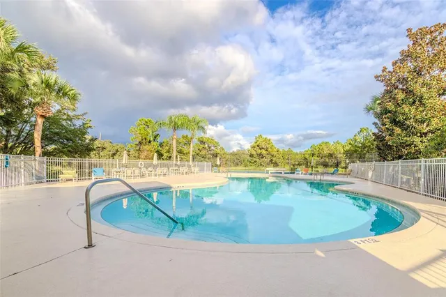 a view of a swimming pool with a terrace