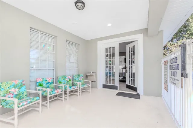 an aerial view of a house with outdoor space and tennis court