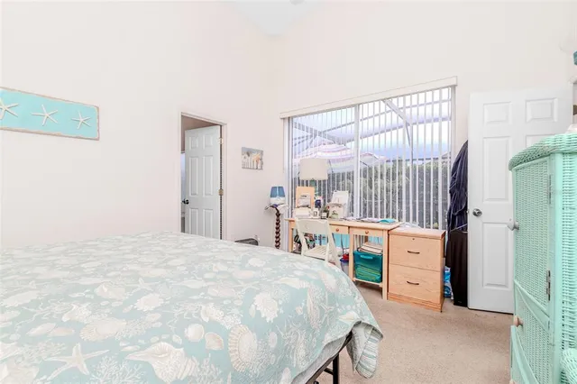 a bed room with a bed and a book shelf