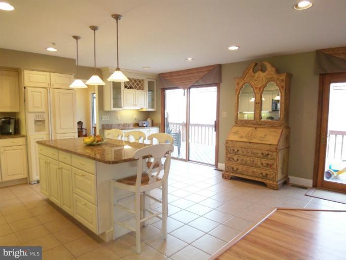 1226 Blue Mt Road Monkton, MD 21111 - Photo 1 of 30 a kitchen with stainless steel appliances granite countertop a stove a sink and a refrigerator
