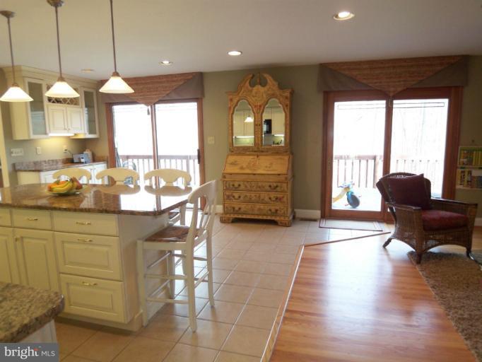 1226 Blue Mt Road Monkton, MD 21111 - Photo 18 of 30 a kitchen with stainless steel appliances granite countertop a stove and a wooden cabinets